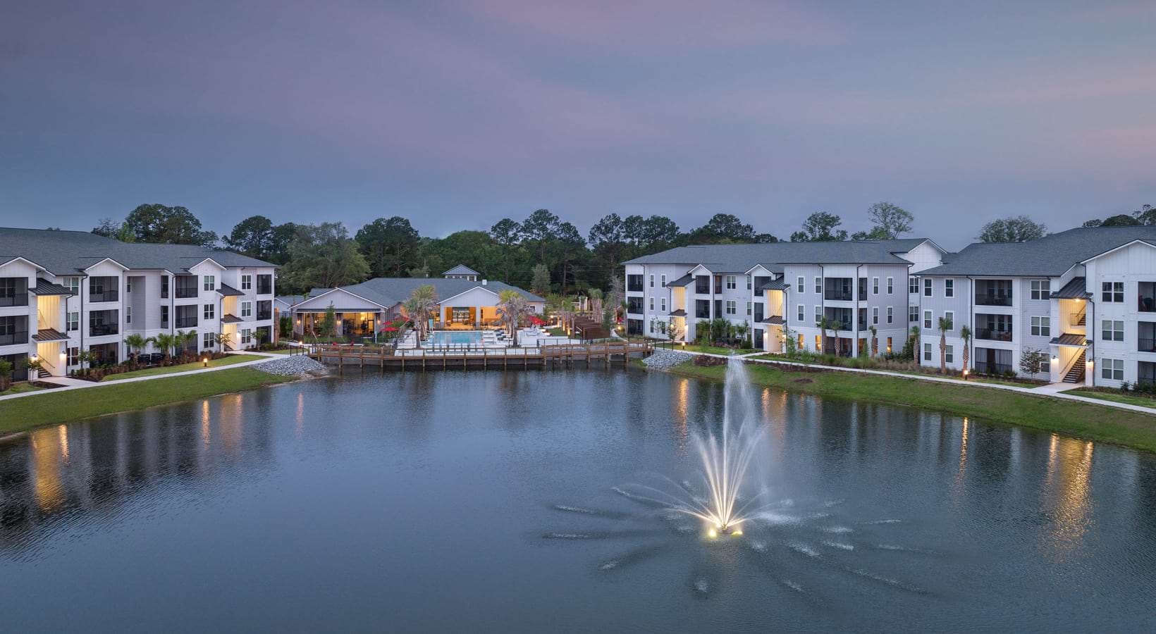 Aventon-Soraya-Dusk-Aerial-Wide-to-Pond-Fountain-and-Pool